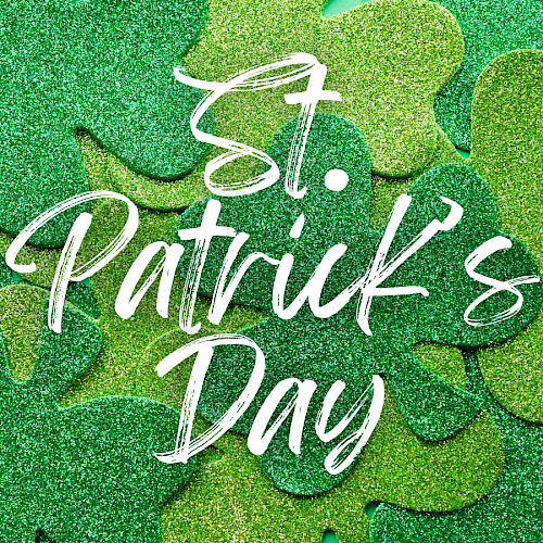 Green glittery shamrocks with "St. Patrick's Day" written in white script over them.